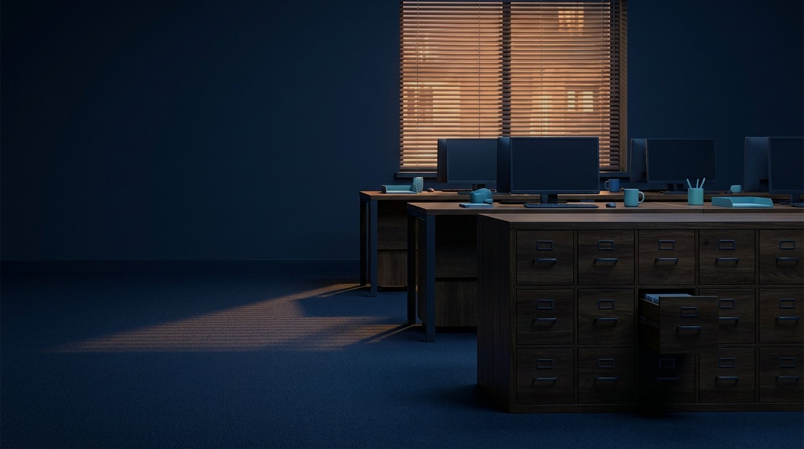 Small insurance agency office at dusk, empty desks and a wall of wooden file drawers