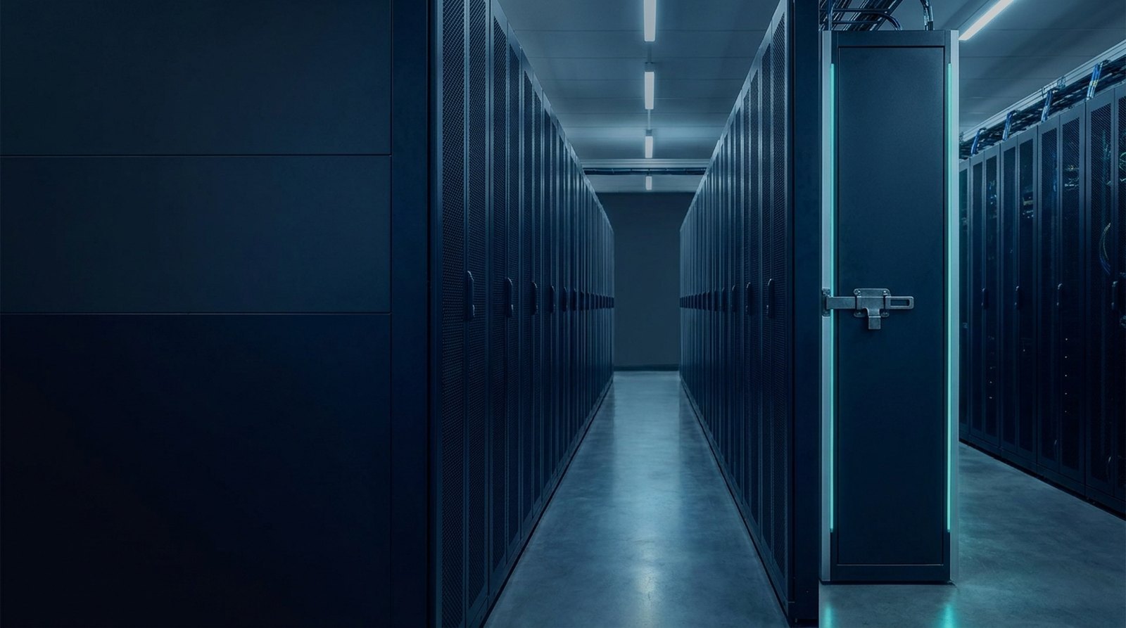 Data centre cold aisle at night with locked server cabinets receding into the dark
